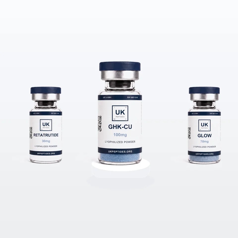 GHK-Cu, Retatrutide and Glow vials on a dark reflective surface